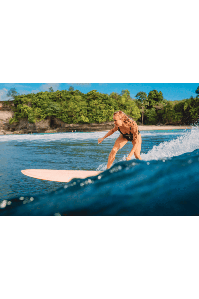 Female surfer in tropical location