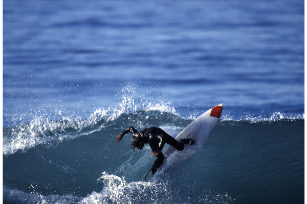 surfer hitting the lip